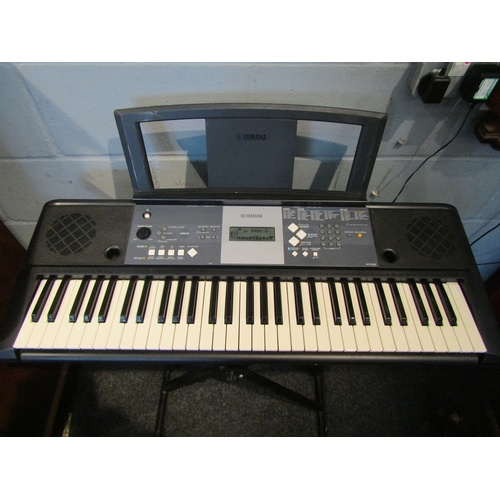 1064A - A Yamaha YPT-230 electric keyboard on stand with power lead