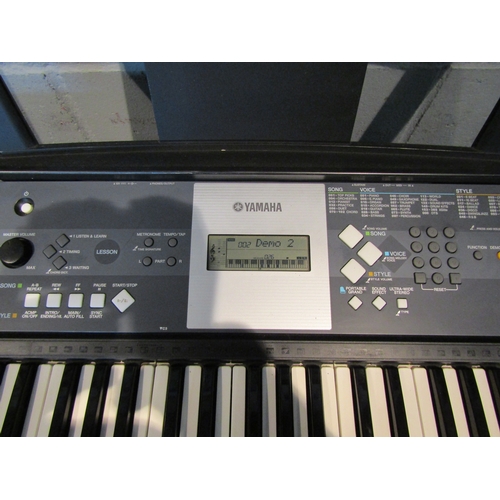 1064A - A Yamaha YPT-230 electric keyboard on stand with power lead