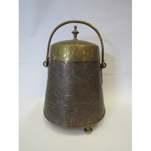 1065 - A copper engraved footed lidded coal scuttle depicting Dutch figures