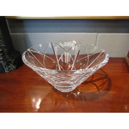 1072 - An Orrefors glass bowl with paper label and signed to base, fleabite chip to rim, 14.5cm tall x 26cm... 