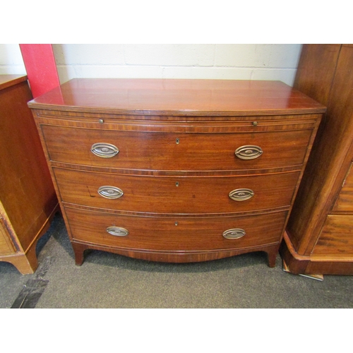 1076 - A Regency mahogany bow front bachelor's chest of three long drawers with brushing slide, a/f, 85cm t... 