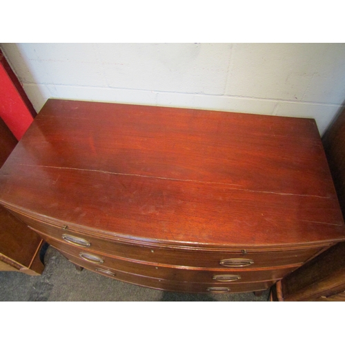 1076 - A Regency mahogany bow front bachelor's chest of three long drawers with brushing slide, a/f, 85cm t... 