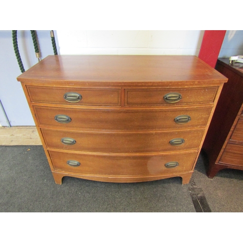 1080 - A Georgian style mahogany bow front chest of two short over three graduating long drawers, water dam... 