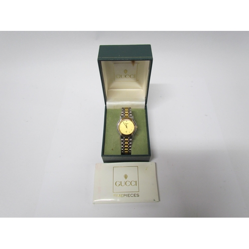 8134 - A lady's Gucci wristwatch Model No 1611524, bi-metallic with date aperture, boxed with paperwork