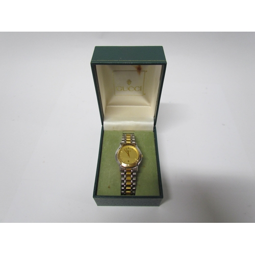 8134 - A lady's Gucci wristwatch Model No 1611524, bi-metallic with date aperture, boxed with paperwork