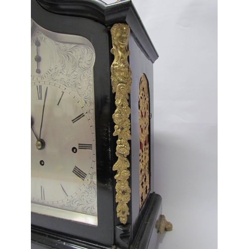 8071 - An 18th Century English ebonised bracket clock with cast brass feet, finials and side fret panels, s... 