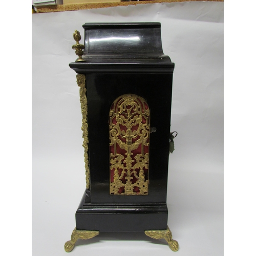 8071 - An 18th Century English ebonised bracket clock with cast brass feet, finials and side fret panels, s... 