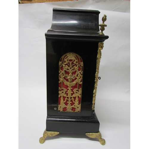 8071 - An 18th Century English ebonised bracket clock with cast brass feet, finials and side fret panels, s... 