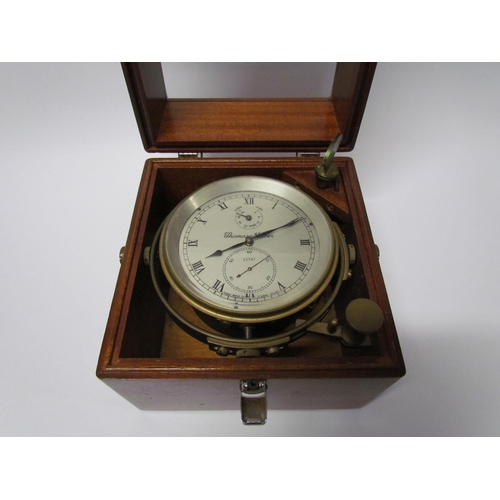 8079 - An early 20th Century marine chronometer by Thomas Mercer Ltd. , silvered Roman dial in brass gimbal... 