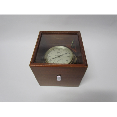 8079 - An early 20th Century marine chronometer by Thomas Mercer Ltd. , silvered Roman dial in brass gimbal... 