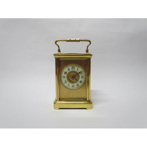 8082 - An early 20th Century brass cased carriage clock with 8-day movement striking on a gong. Arabic enam... 