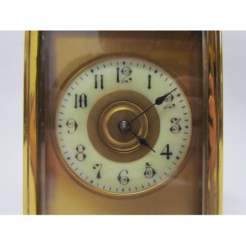 8082 - An early 20th Century brass cased carriage clock with 8-day movement striking on a gong. Arabic enam... 