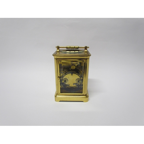 8082 - An early 20th Century brass cased carriage clock with 8-day movement striking on a gong. Arabic enam... 