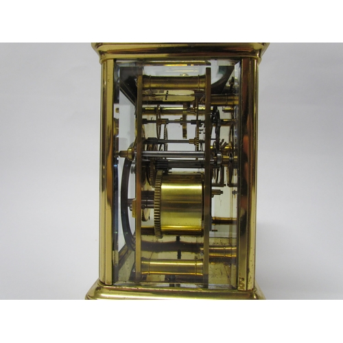 8082 - An early 20th Century brass cased carriage clock with 8-day movement striking on a gong. Arabic enam... 