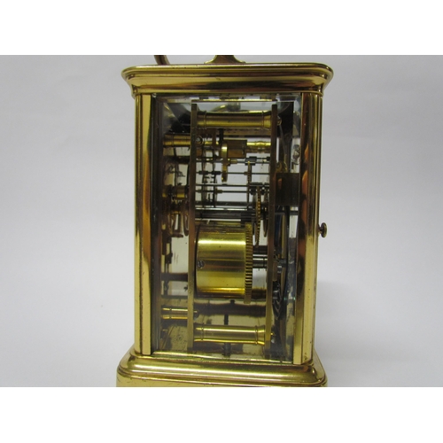 8082 - An early 20th Century brass cased carriage clock with 8-day movement striking on a gong. Arabic enam... 