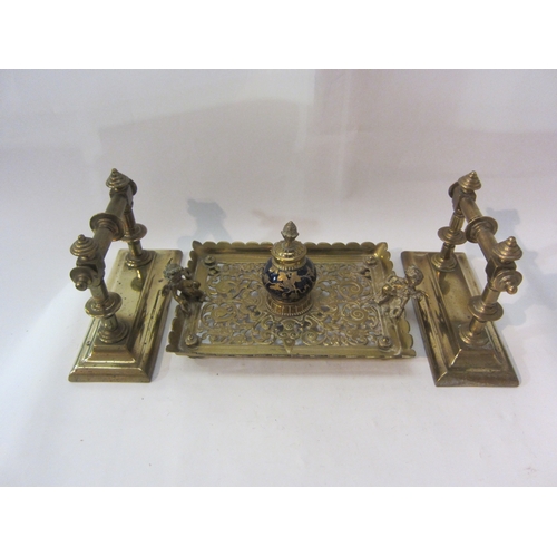 1436 - A pair of brass fire dogs and a pierced brass inkwell with cobalt blue globe