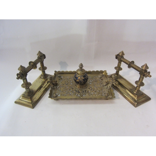 1436 - A pair of brass fire dogs and a pierced brass inkwell with cobalt blue globe