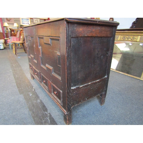 1015 - A late 17th/early 18th Century oak geometric panel mule chest with two drawers, 78cm tall x 115cm wi... 