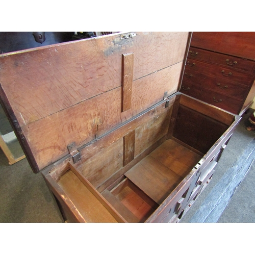 1015 - A late 17th/early 18th Century oak geometric panel mule chest with two drawers, 78cm tall x 115cm wi... 