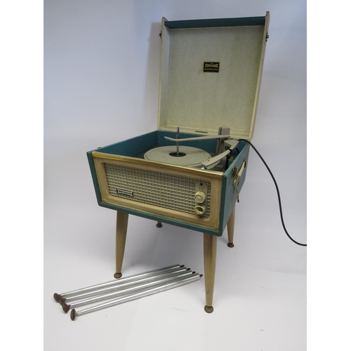 7386 - A mid 20th Century Dansette Bermuda record player, raised on associated tapering legs, together with... 