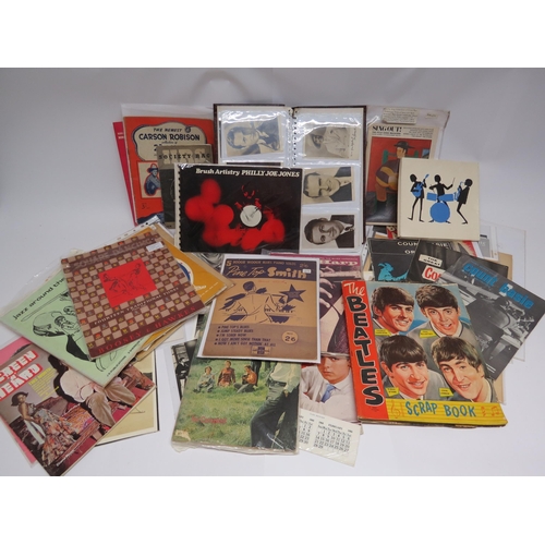 7310 - A collection of assorted film and music ephemera including film star photocards, Beatles scrapbook w... 