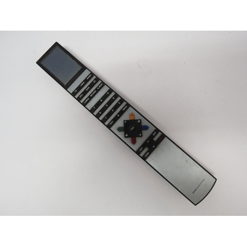 7338 - A Bang & Olufsen Beovision Avant television with remote (missing battery cover)