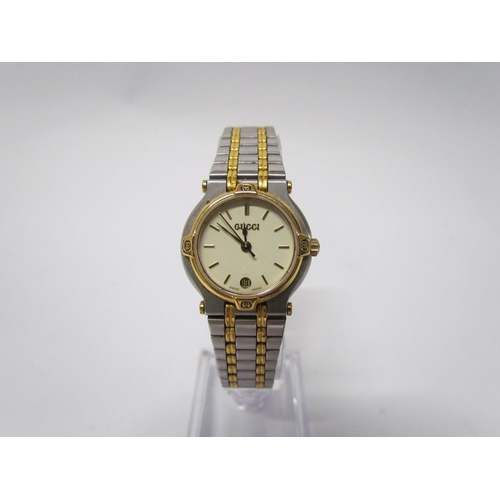 8175 - A lady's Gucci wristwatch model 9000L, bi-metallic strap, boxed with paperwork