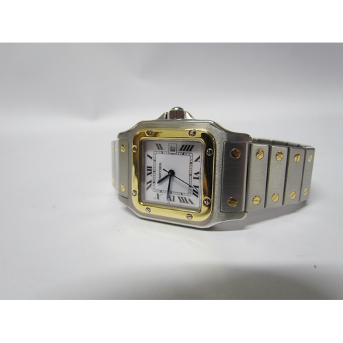 8129 - A Cartier Santos men's wristwatch, steel and 18ct gold with sapphire crown, with documentation, case... 