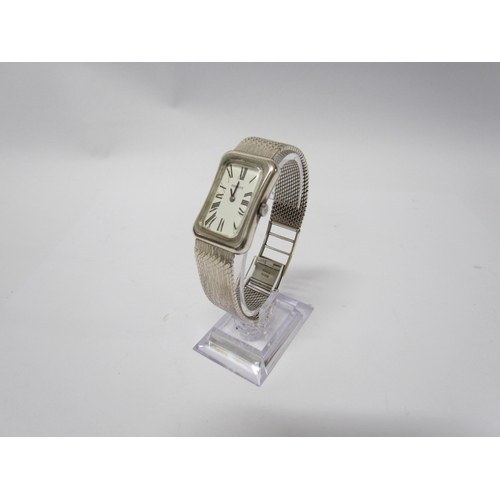 8137 - A Tissot silver wristwatch of cushion style, Deco form face, snake link strap, cased