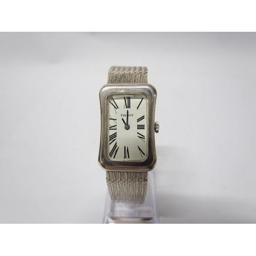 8137 - A Tissot silver wristwatch of cushion style, Deco form face, snake link strap, cased