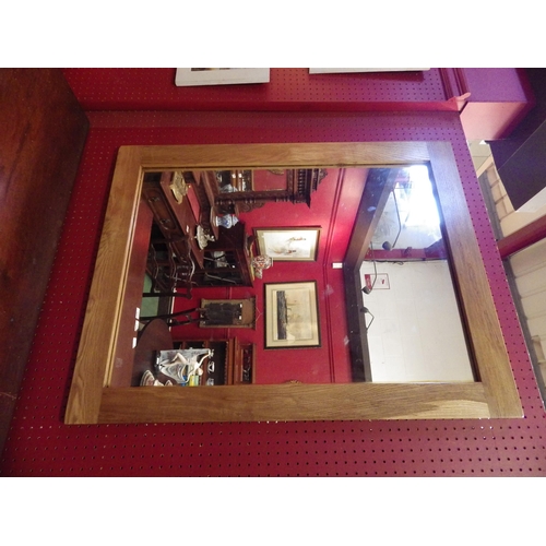 4062 - A modern oak framed rectangular wall mirror, 91cm x 71cm