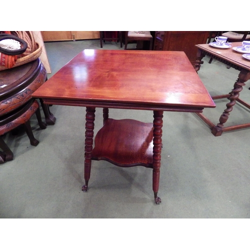 4110 - A circa 1900 two tier lamp table, the square top on ring turned bobbin legs and glass ball in brass ... 