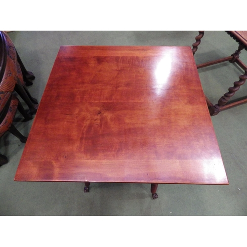 4110 - A circa 1900 two tier lamp table, the square top on ring turned bobbin legs and glass ball in brass ... 