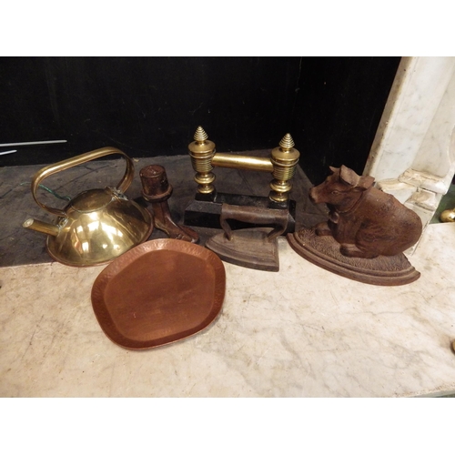 4154 - A mixed lot of metal wares including fire dog, brass kettle, Teachers Whisky tray, cast iron cow for... 