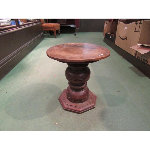 4218 - A small oak pedestal, 36cm tall x 34cm diameter