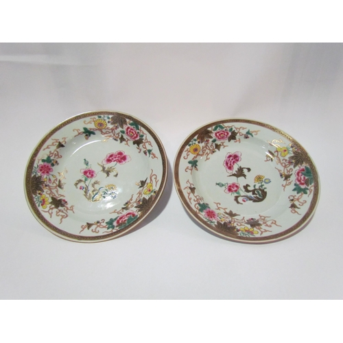 4244 - A pair of early 19th Century famille rose plates, 23cm diameter a/f