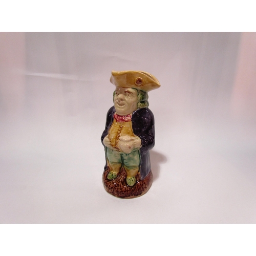 4248 - A Victorian majolica Toby jug, crazing and firing marks. 25cm tall     (R) £0 (E) £10-15