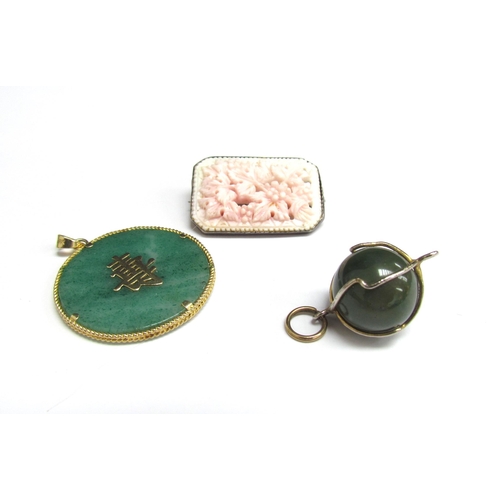 4365 - A circular jade pendant with 14k gold mount, a jade ball pendant and pink coral brooch