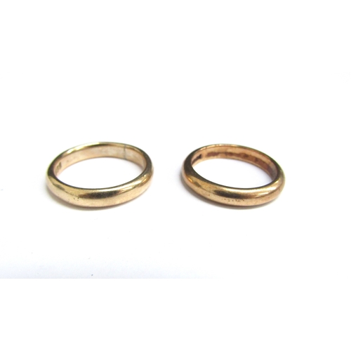 4373 - Two 9ct gold wedding bands. Sizes J and K, 5.7g