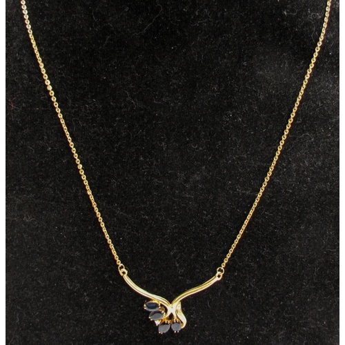 4359 - A gold neckchain having a scrolled bar set with four oval sapphires and four diamonds, stamped 750, ... 