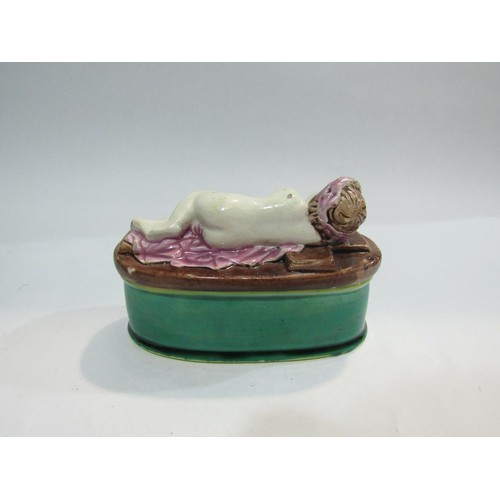 4324 - A Victorian majolica pin box with cherub design, 14cm long a/f   (R) £35