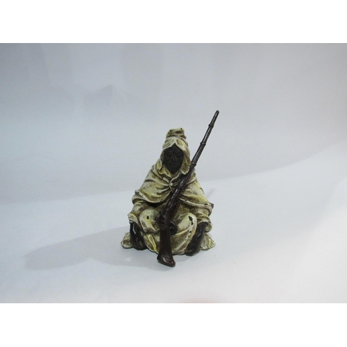 4321 - An Austrian cold-painted bronze Arab in cloak with rifle. 11cm tall        (R) £200