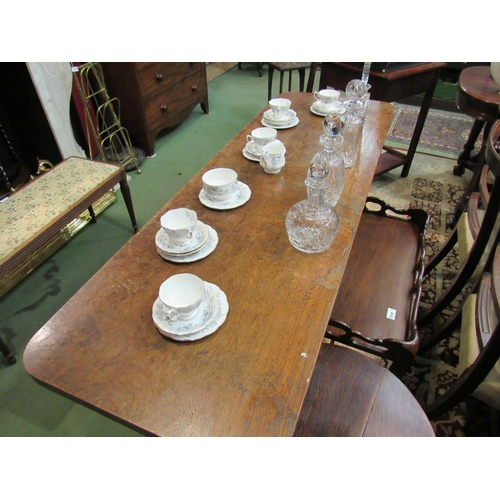 4168 - An oak serving table, carved supports on stretcher base, 74cm tall x 168cm long x 56cm wide