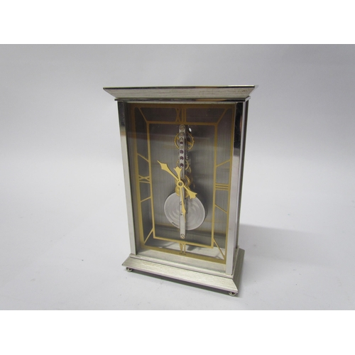 8083 - A Jaeger Le Coultre No. 481 mantel clock, visible skeleton movement set with rubies, stainless steel... 