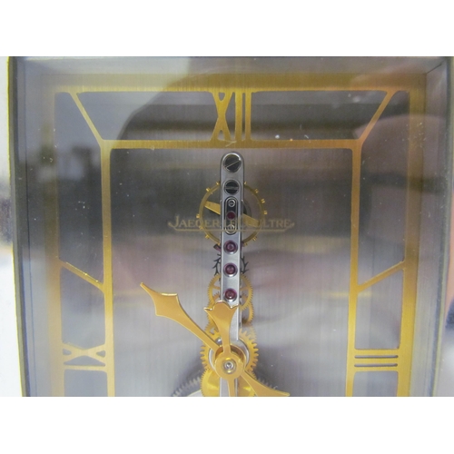 8083 - A Jaeger Le Coultre No. 481 mantel clock, visible skeleton movement set with rubies, stainless steel... 