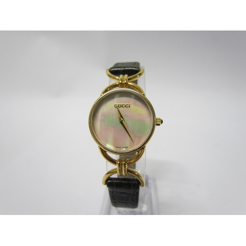 8140 - A lady's Gucci mother of pearl face wristwatch