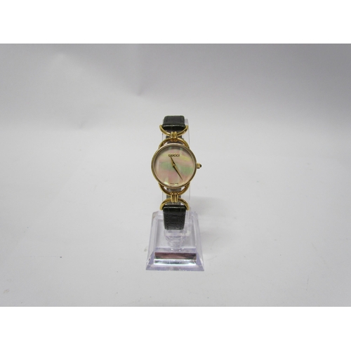 8140 - A lady's Gucci mother of pearl face wristwatch