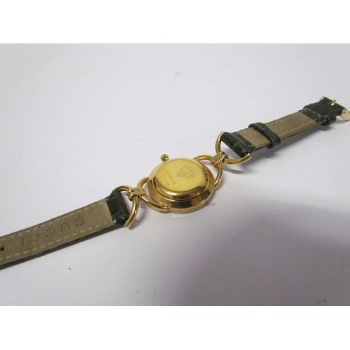 8140 - A lady's Gucci mother of pearl face wristwatch