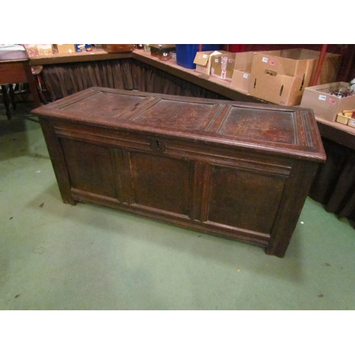 4003 - A late 17th/early 18th Century oak three panel coffer, candle box compartment interior, stile feet, ... 