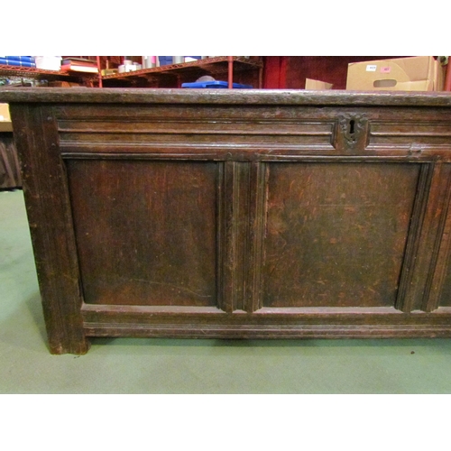 4003 - A late 17th/early 18th Century oak three panel coffer, candle box compartment interior, stile feet, ... 